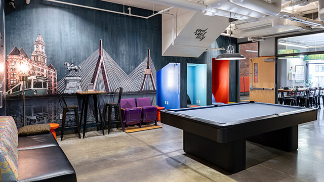 The game room at HI Boston Hostel features a full-sized billiards table