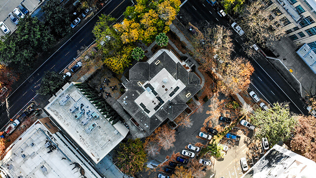 an aerial view of the lot at the corner of H and 9th Streets in Sacramento where HI Sacramento hostel is located