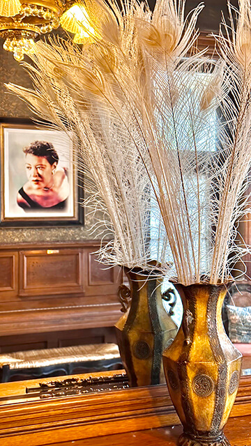 in HI Sacramento hostel's music room, a portrait of a historic woman musician sits on a piano for guests to play