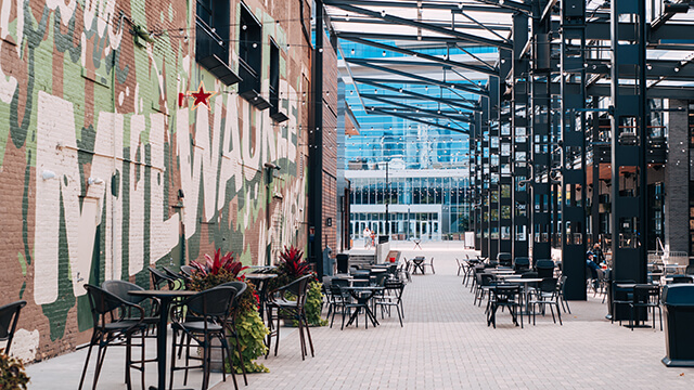 a mural on the brick wall of a restaurant in deer district in milwaukee