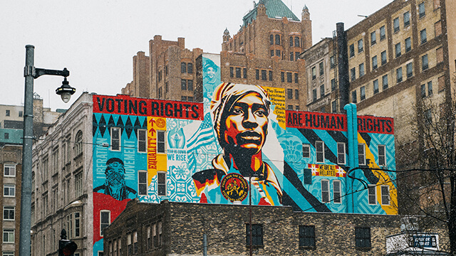 a mural by Shepard Fairey in Milwaukee