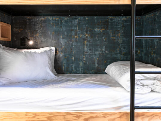 HI USA hostel dorm rooms offer accessible bottom bunks like this one for travelers with limited mobility