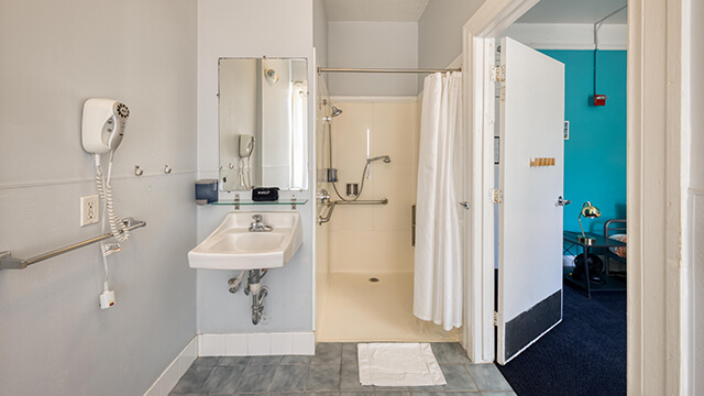 An ADA bathroom at a HI USA hostel with roll-in shower