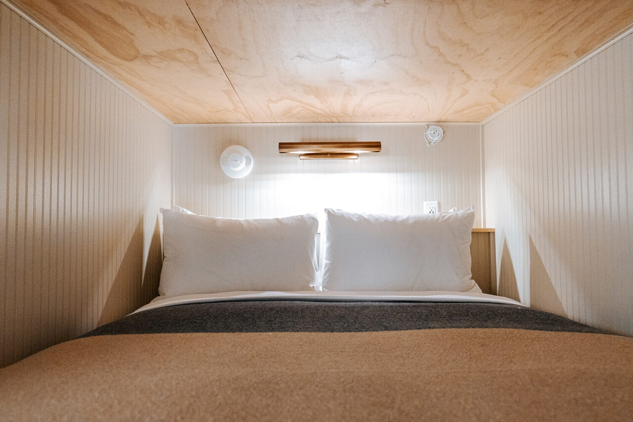 a full sized pod-style bunk bed at HI Jackson hostel the cache house