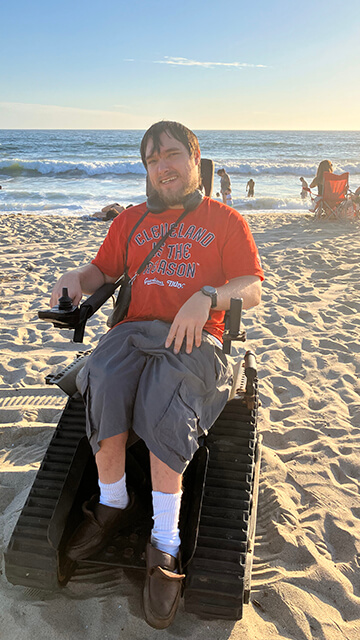 Peter Knab, who attended every Cleveland Guardians game in 2023, in a special beach wheelchair in Santa Monica