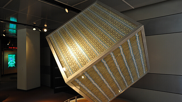 a transparent cube containing one million one-dollar bills at the Chicago Federal Reserve's money museum