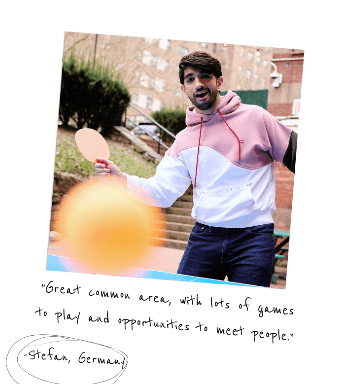 a polaroid photo of a young man in a pink-and-white hoodie playing table tennis outdoors. There is handwriting on the bottom of the photo reading