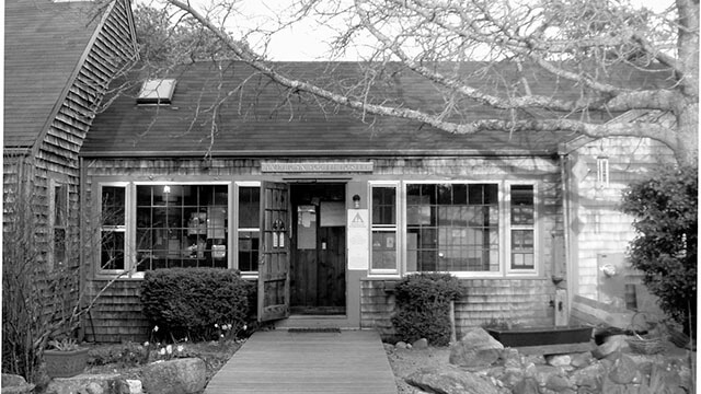 A black and white photo of the entrance of the American Youth Hostel on Martha's Vineyard, now called HI Martha's Vineyard Hostel