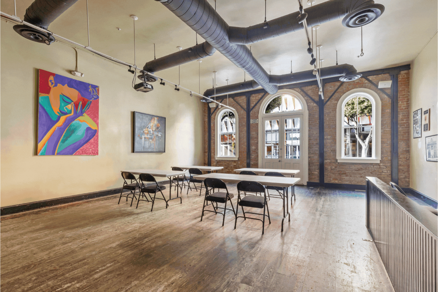 The Rapp Saloon meeting venue at HI Los Angeles Santa Monica features wood floors, brick walls, and high ceilings. It can accommodate up to 50 people and be set up in a variety of ways with tables, chairs, and A/V equipment.
