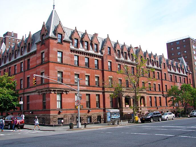 The exterior of HI New York City hostel, an enormous Gilded Age-era brick building, as seen from Amsterdam Avenue.