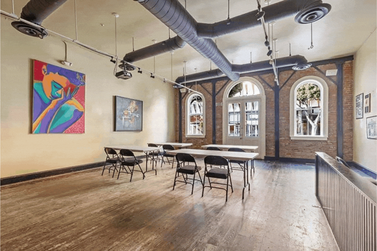 The Rapp Saloon meeting venue at HI Los Angeles Santa Monica features wood floors, brick walls, and high ceilings. It can accommodate up to 50 people and be set up in a variety of ways with tables, chairs, and A/V equipment.