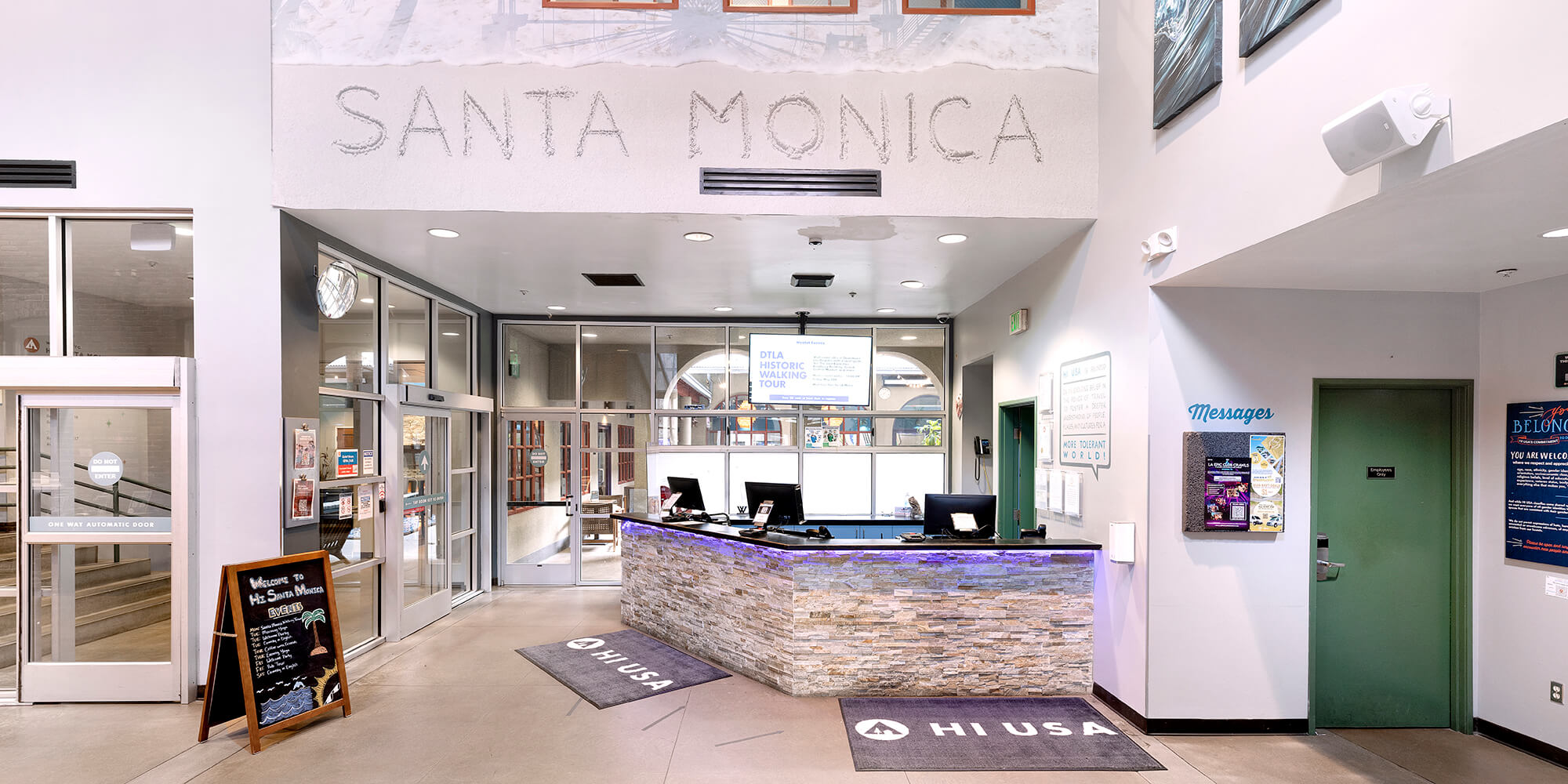 The airy and spacious lobby and front desk of HI Los Angeles Santa Monica hostel