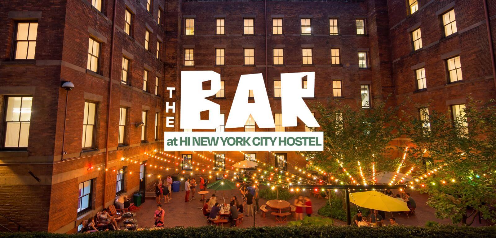 An image of the outdoor patio at HI New York City with rainbow string lights overhead. There is white text overlaid that says 