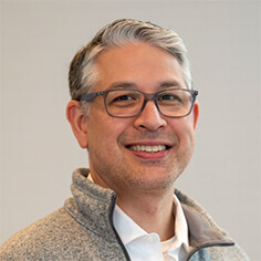 A headshot of HI USA Board Member Miguel Ramirez